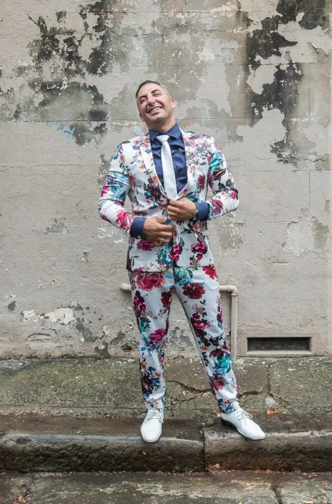 Johan the Celebrant & MC in his signature floral suit ready to bring joy to every wedding celebration!